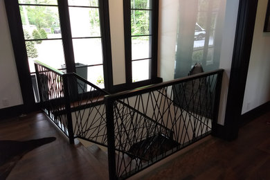 Inspiration for a modern metal railing staircase remodel in Grand Rapids