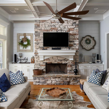 Family Room – Stone Fireplace Flanked by Built-In Cabinets and Shiplap