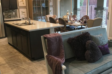 Kitchen/dining room combo - large modern porcelain tile and multicolored floor kitchen/dining room combo idea in Las Vegas with beige walls