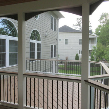 Railing is Trex Transcends with black balusters and Wolf Amberwood top cap