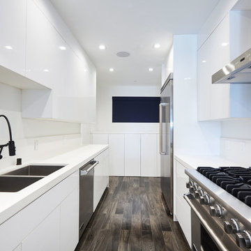 Symmetrical Kitchen View With Sink and Range Walls