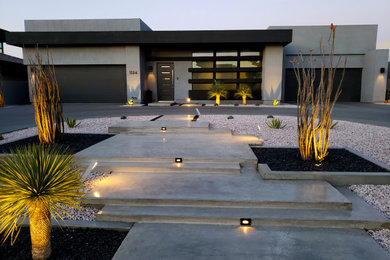 Huge minimalist gray three-story concrete exterior home photo in Las Vegas