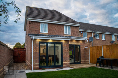 Inspiration for a small and beige contemporary two floor brick semi-detached house in West Midlands with a pitched roof, a tiled roof and a brown roof.