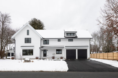 Example of a large trendy two-story exterior home design in Boston