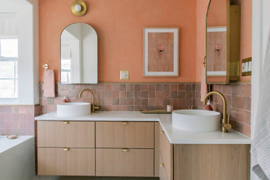 Example of a mid-sized trendy double-sink bathroom design in Austin with flat-panel cabinets, light wood cabinets, marble countertops, white countertops and a floating vanity