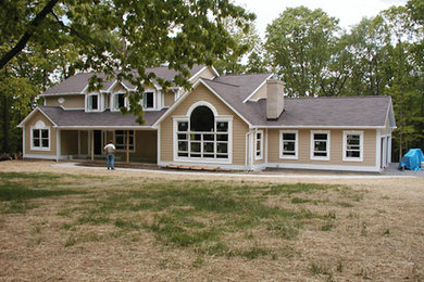Inspiration for a large brown two-story wood exterior home remodel in Other