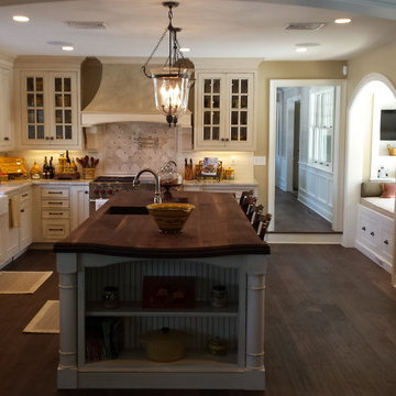 Traditional Kitchen with Off White Cabinets and Island with Walnut Countertop
