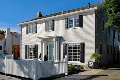 Example of a mid-sized classic beige two-story wood and clapboard house exterior design in San Francisco