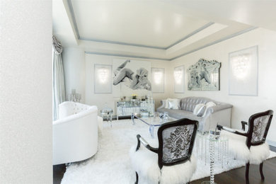 Example of a large transitional formal and open concept dark wood floor and brown floor living room design in New York with white walls