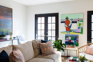 Small beach style beige floor living room photo in DC Metro with white walls