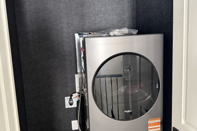 Example of a trendy laundry room design in Calgary