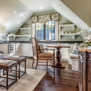 Small tuscan open concept dark wood floor and brown floor living room photo in Other with gray walls and a wall-mounted tv
