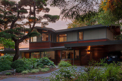 Inspiration for a mid-sized mid-century modern home design remodel in Seattle