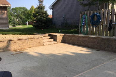 Pool - mid-sized modern backyard stamped concrete and rectangular pool idea in Minneapolis