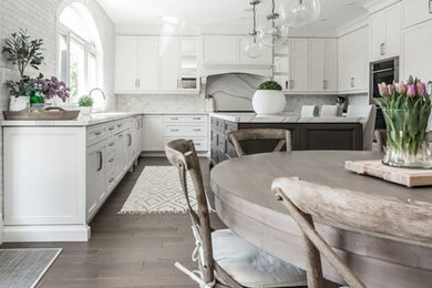 Example of a transitional home design design in Toronto