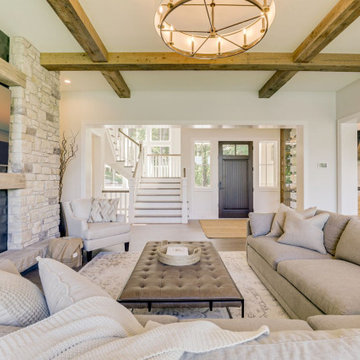 Reclaimed Wood Beams and Mantel in Stone Fireplace Room