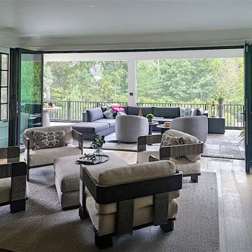 Seamless Living Room to Porch Flow Through the Open Wall