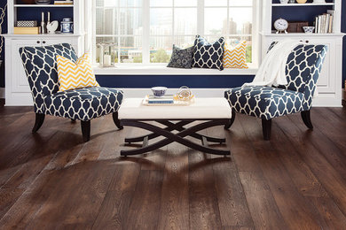 Example of a mid-sized classic enclosed dark wood floor and brown floor living room design in Austin with blue walls, no fireplace and no tv