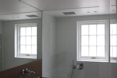 Inspiration for a mid-sized contemporary master white tile medium tone wood floor bathroom remodel in London with medium tone wood cabinets, wood countertops and white walls