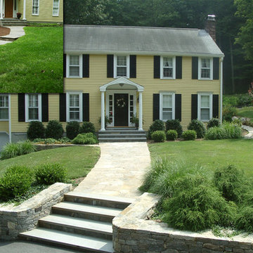 A wide curved walk leads you to the front door. Clipped plantings complement the