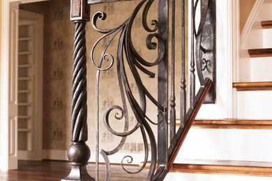 Staircase - mid-sized traditional wooden straight staircase idea in Louisville with painted risers