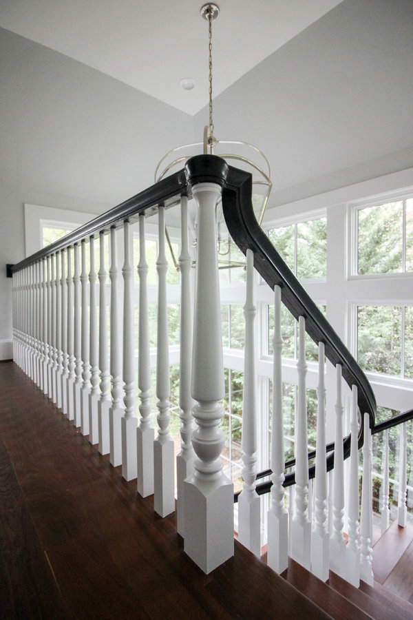 Powerful Impression by Floating Staircase in Suburban Foyer