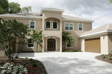 Example of a tuscan exterior home design in Tampa