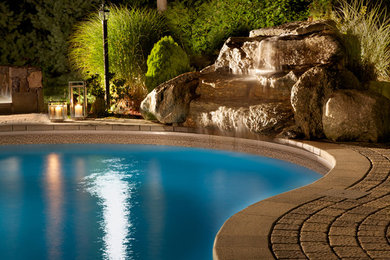 Inspiration for a mid-sized contemporary pool remodel in New York