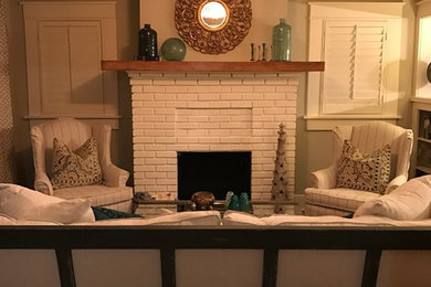 Example of a mid-sized arts and crafts open concept medium tone wood floor living room design in Dallas with gray walls, a standard fireplace, a brick fireplace and no tv