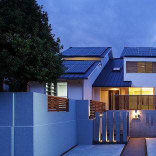 大阪の大きい片開きドアコンテンポラリースタイルのおしゃれな玄関ドア (濃色木目調のドア) の写真