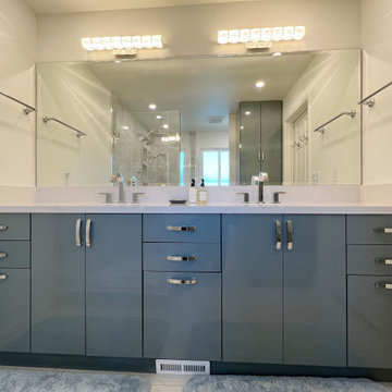 Contemporary Double Vanity Bathroom Remodel in Aliso Viejo with Sleek Blue Cabin