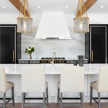 Reclaimed Wood Box Beams Framing a Contemporary Kitchen with Black Cabinetry