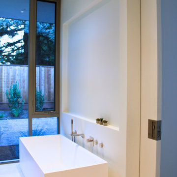 Freestanding Soaking Tub with Full-Height Pocket Door