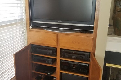 Inspiration for a large timeless living room remodel in Nashville with a media wall