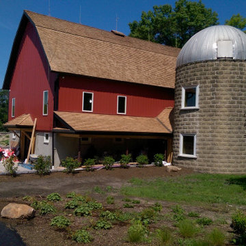 new roofing and red metal siding