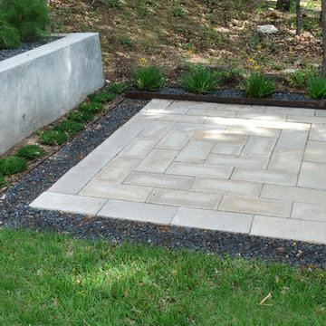 Concrete Pavers and Black Gravel Patio