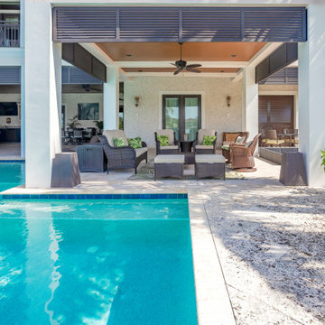 Serene Coastal Patio with Modern Wooden Sofa Ensemble