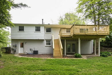 Inspiration for a mid-sized transitional gray two-story house exterior remodel in DC Metro with a shingle roof