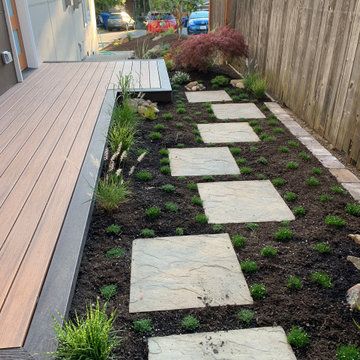 Deck platform, fence, hardscape, garden and planters.