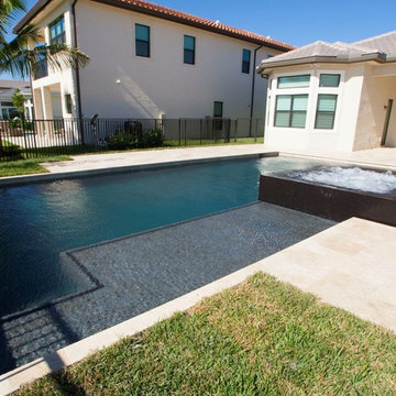 New Pool with Sunshelf and Pebble Tec Finish in Delray Beach Florida