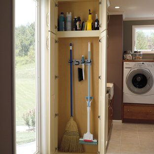 Inspiration for a medium sized traditional l-shaped utility room in Indianapolis with a belfast sink, shaker cabinets, brown walls, a side by side washer and dryer, ceramic flooring and beige cabinets.