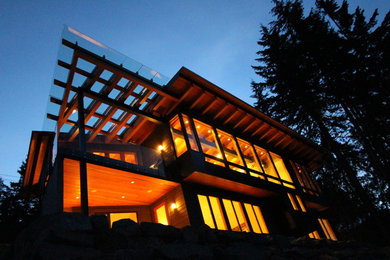 Inspiration for a large rustic gray two-story wood exterior home remodel in Vancouver