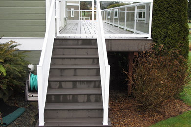 Large backyard deck photo in Seattle with no cover
