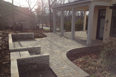 Inspiration for a large timeless backyard brick patio remodel in Cincinnati with a roof extension