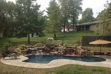 Inspiration for a small backyard stamped concrete and custom-shaped natural pool remodel in Cincinnati