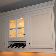Wine bottles under cabinet