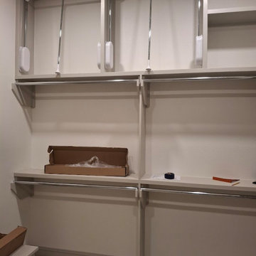 Custom Closet Built-In with Hydraulic Pull-Down Wardrobe Lifts