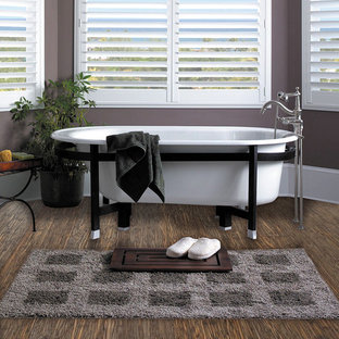 Freestanding bathtub - mid-sized zen master bamboo floor freestanding bathtub idea in Chicago with gray walls