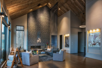 Photo of a large modern formal open concept living room in Denver with grey walls, a ribbon fireplace, a tile fireplace surround, no tv, ceramic floors and grey floor.