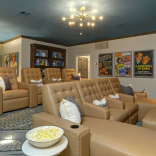 Design ideas for a large contemporary open plan home cinema in Oklahoma City with beige walls, carpet and a wall mounted tv.